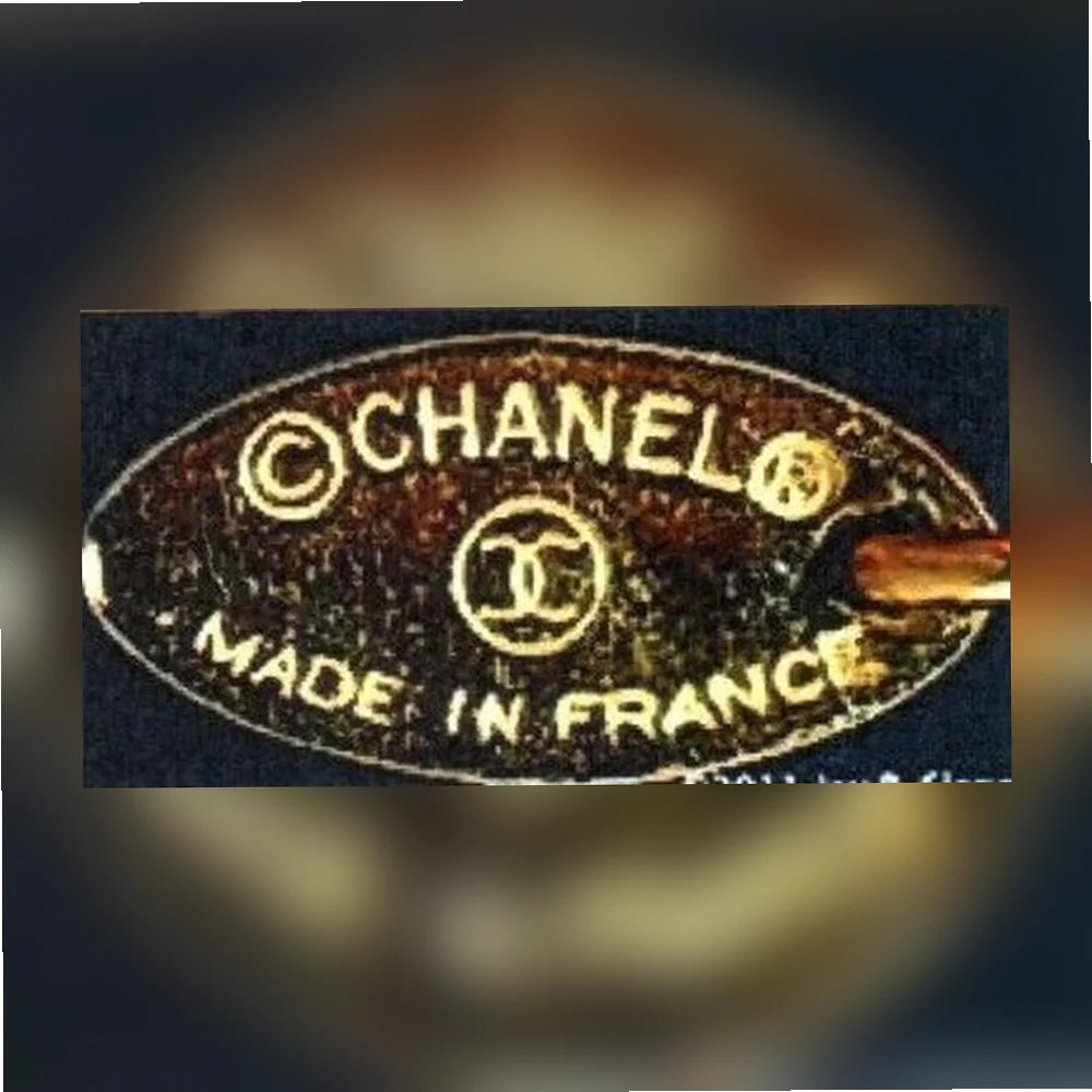 1980-е гг CHANEL в овальной оправе, знак авторского права и защищенной марки,логотип двух перекрещивающихся СС и подпись MADE IN FRANCE